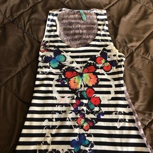 Butterfly and black and white striped tank top